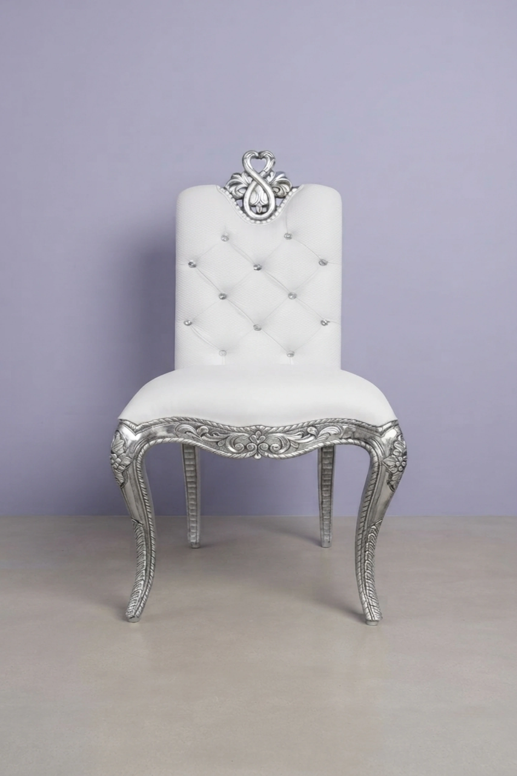 Chiyo silver chair,silver accent chair,luxury upholstered silver chair,designer silver lounge chair,silver velvet accent seating,premium silver interior chair,artisan upholstered silver chairChiyo_Silver_Chair_image_01_front_view_luxury_velvet_accent_chair_lounge_seating_designer_living_room_upholstered_artisan_premium_interior_furniture.webp