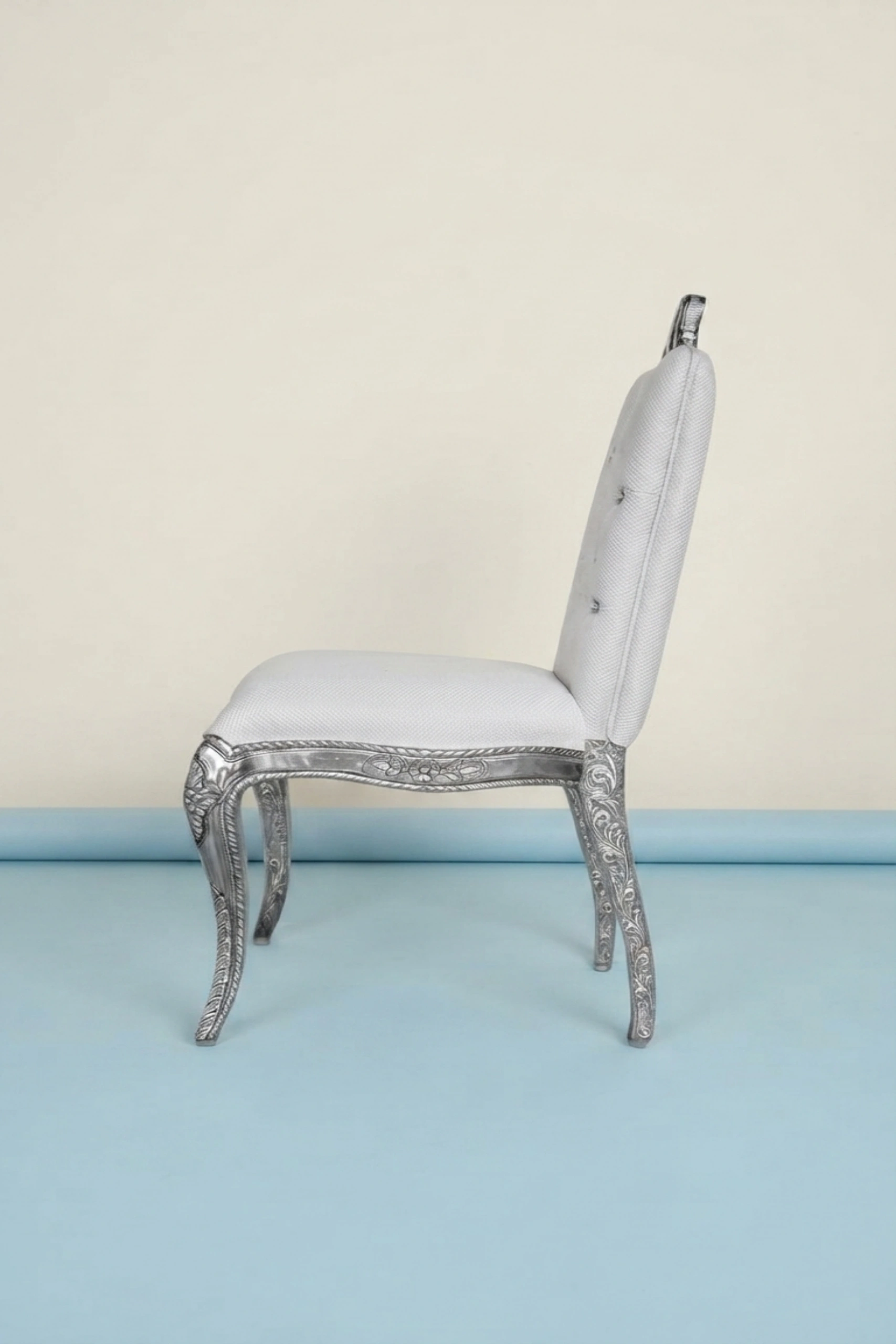 Chiyo_Silver_Chair_image_02_angled_view_luxury_velvet_accent_chair_lounge_seating_designer_living_room_upholstered_artisan_premium_interior_furniture.webp