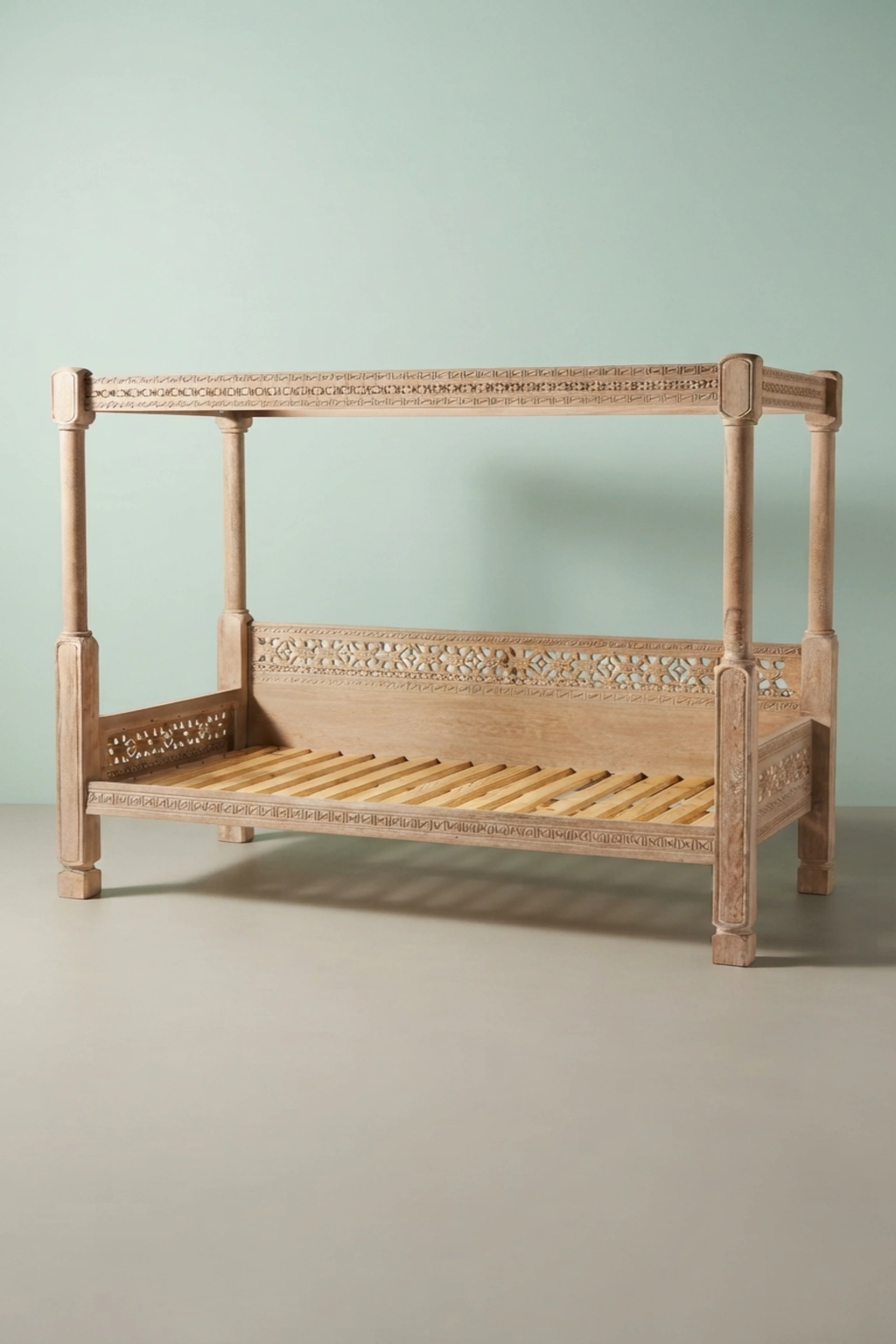 Handcarved_Ezana_Canopy_Daybed_Natural_image_03_side_profile_luxury_handcarved_wooden_daybed_cane_bedroom_living_room_lounge_artisan_premium_interior_furniture.webp