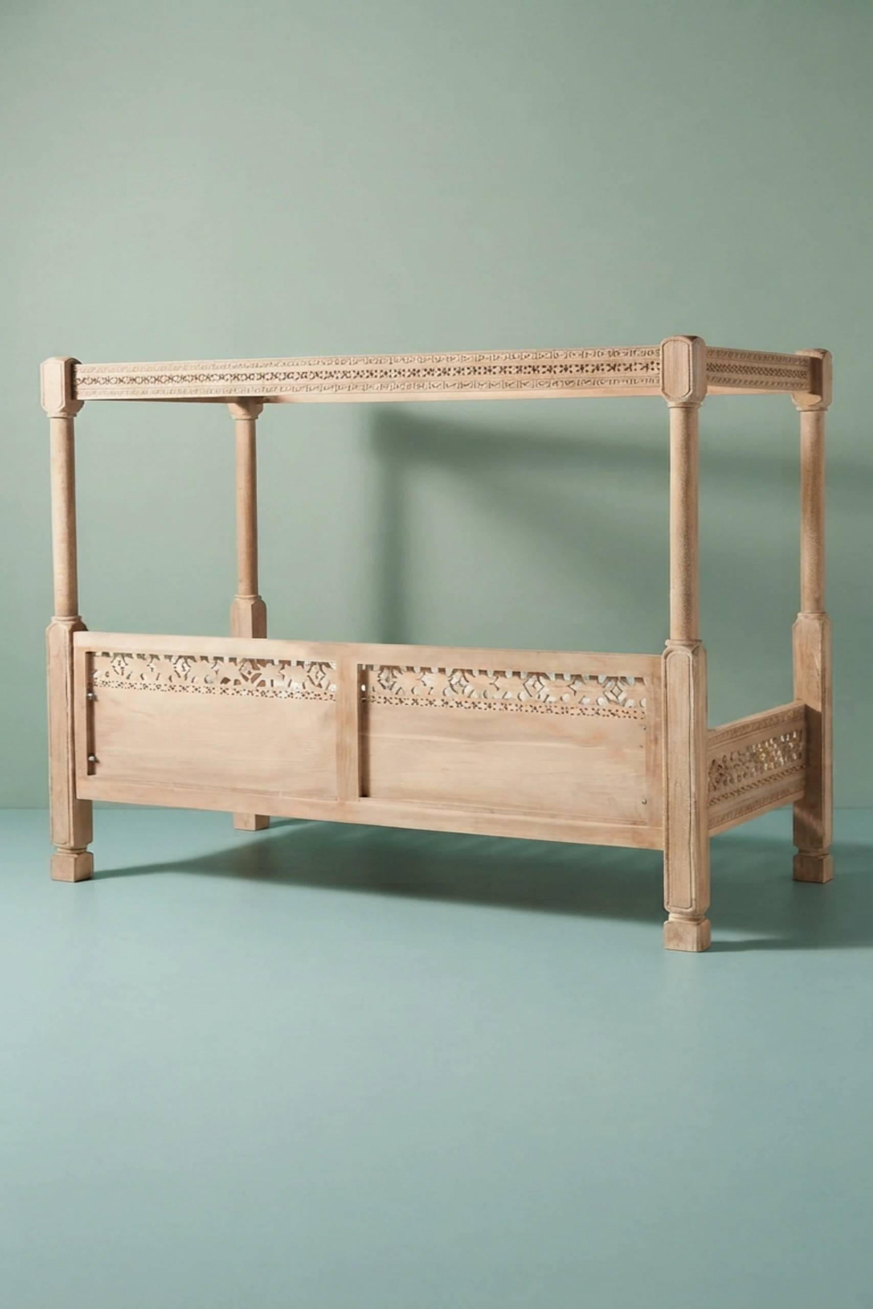 Handcarved_Ezana_Canopy_Daybed_Natural_image_04_carved_detail_luxury_handcarved_wooden_daybed_cane_bedroom_living_room_lounge_artisan_premium_interior_furniture.webp