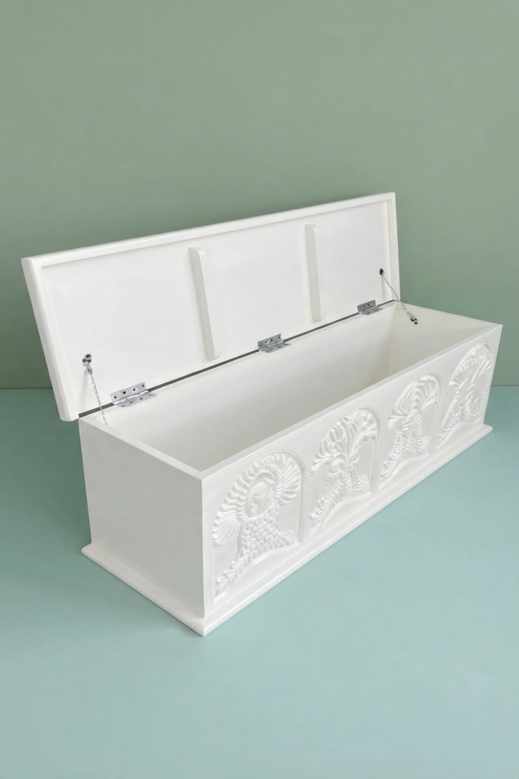 Handcarved_Menagerie_Trunk_White_image_03_side_profile_luxury_handcarved_storage_trunk_chest_white_decorative_bedroom_living_room_artisan_premium_furniture.webp
