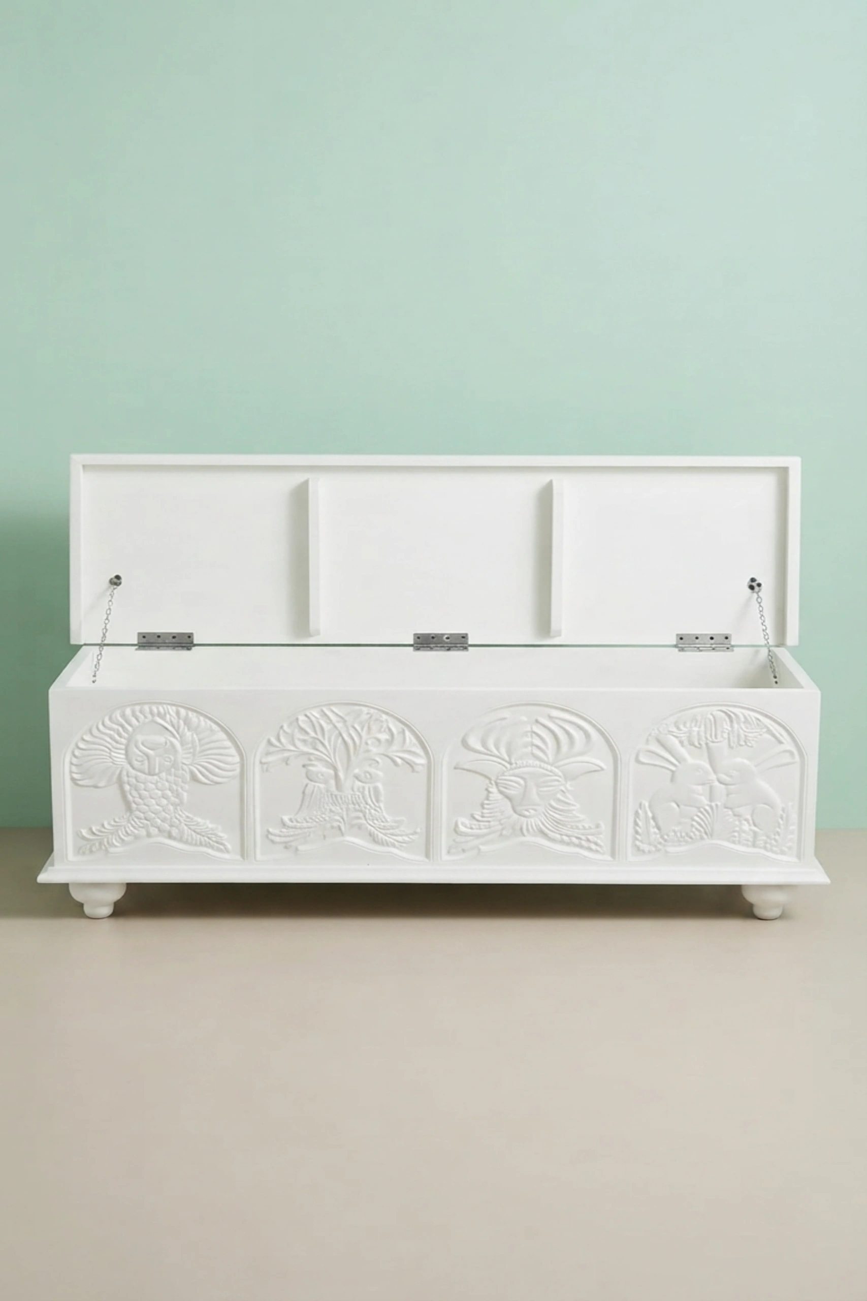 Handcarved_Menagerie_Trunk_White_image_04_carved_detail_luxury_handcarved_storage_trunk_chest_white_decorative_bedroom_living_room_artisan_premium_furniture.webp