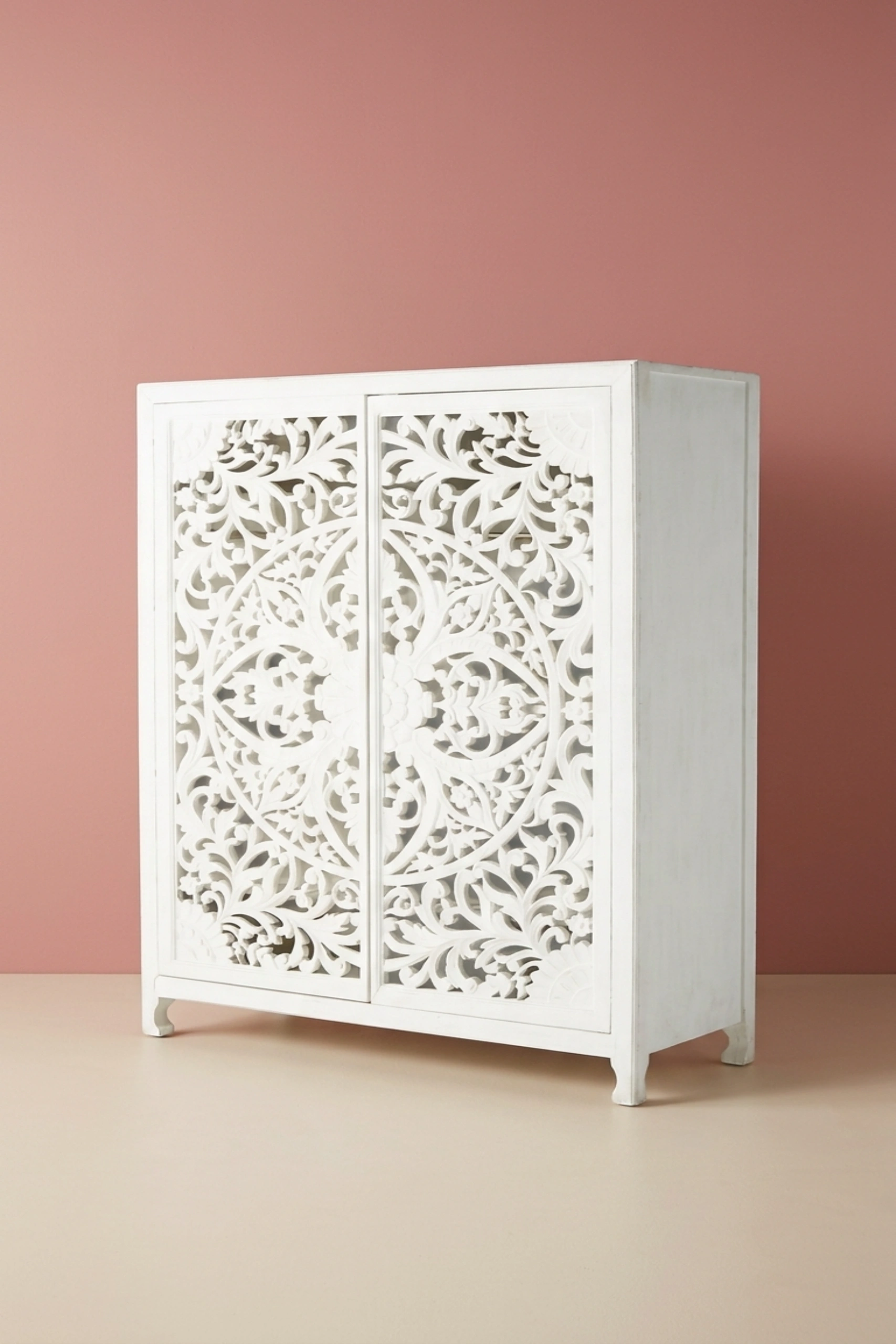 Lombok_Handcarved_2_Door_Wardrobe_White_image_02_angled_view_luxury_storage_wardrobe_armoire_cupboard_handcrafted_bedroom_living_room_artisan_premium_interior_furniture.webp